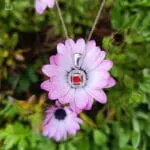 Stainless steel necklace with red square stone rosette pendant