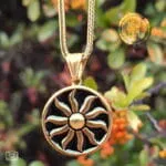 Faethon gold sun pendant necklace from stainless steel with black enamel disk and 50cm foxtail chain.