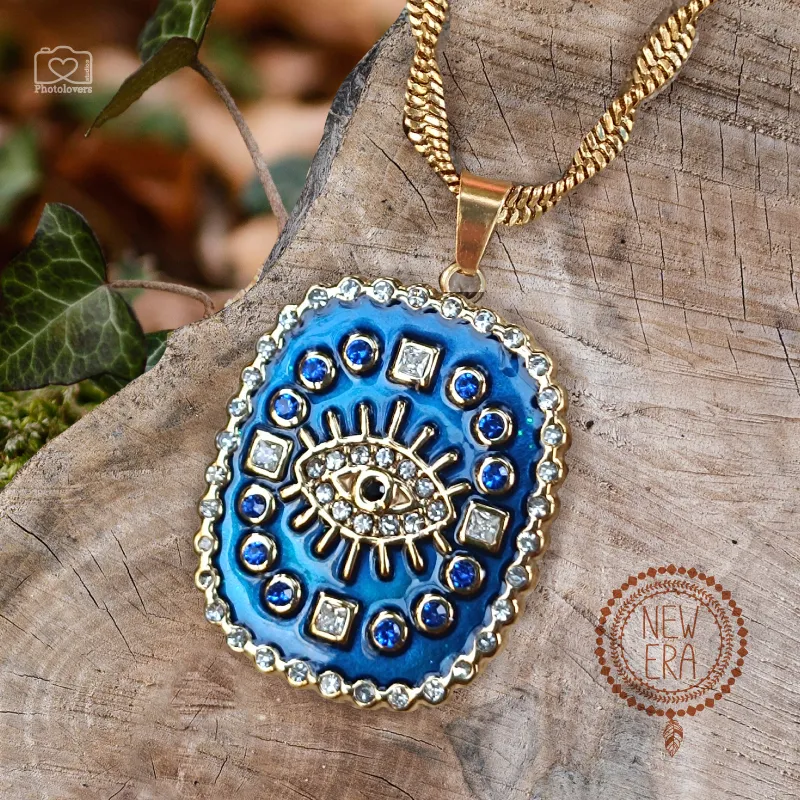 Blue Magic Necklace - Ατσάλινο μενταγιόν με μπλε σμάλτο και πέτρες, αλυσίδα ψαροκόκκαλο στριφτή, χρυσό-μπλε BF05.00018