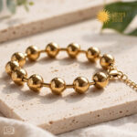 Golden Orbit Bracelet βραχιόλι από ανοξείδωτο ατσάλι σε χρυσό χρώμα με γυαλιστερές μπίλιες 10mm